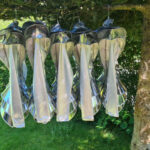 Front view of futuristic silver armor bodysuit photographed outdoors, visionary costume design with geometric structure